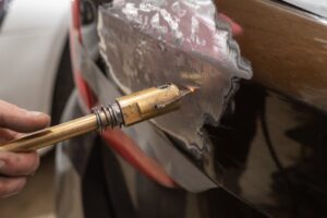 Desabollado de golpes (chapa y aluminio) in english